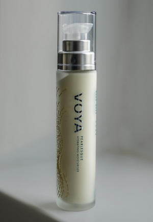 Pearlesque Hydrating Moisturiser | VOYA in a sleek frosted bottle with a clear pump dispenser, designed for nourishing skincare and hydration.
