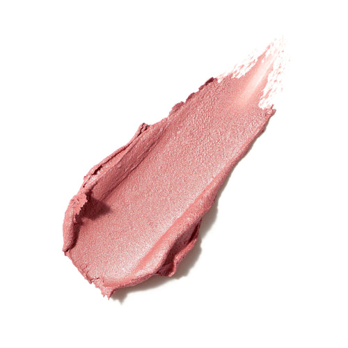 Smudge of smooth, rosy pink cream blush with a subtle shimmer texture, showcasing the Glow Time Blush Stick | Jane Iredale product.