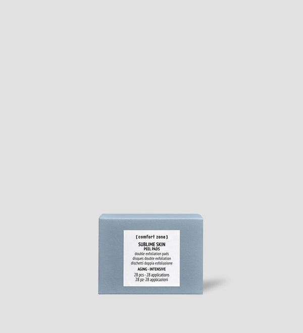 Sublime Skin Peel Pads | [ comfort zone ] in a light blue box with white label, designed for skincare exfoliation and aging skin care in a minimalist setting.