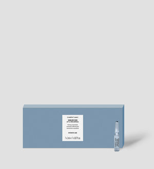 Blue box packaging with a small clear ampoule vial beside it, featuring Sublime Skin Lift & Firm Ampoules | [ comfort zone ] skincare product for intensive care and skin firming.