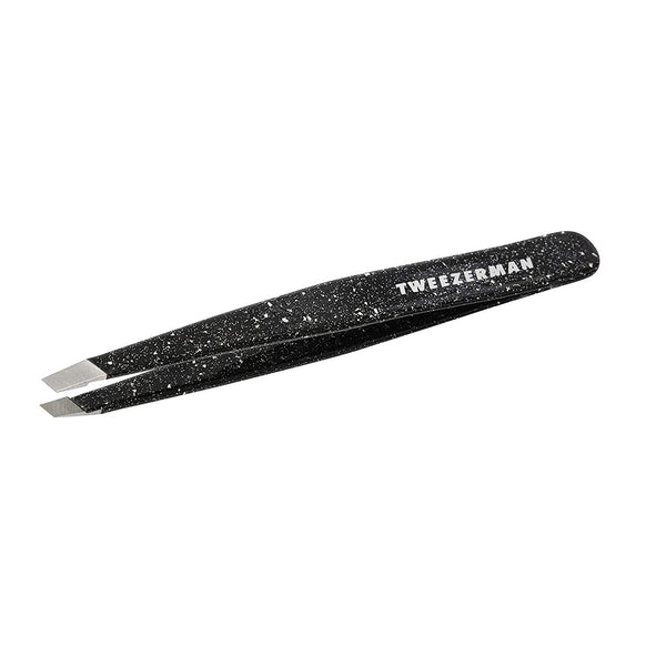 Anniversary Slant Tweezer | Tweezerman in black with a speckled design, featuring angled precision tips for effective eyebrow grooming and skincare routines.
