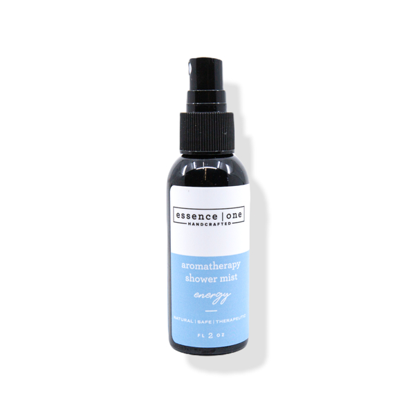 Bottle of Aromatherapy Shower Mist | Essence One with a blue label, featuring a black spray cap, designed for skincare and wellness.