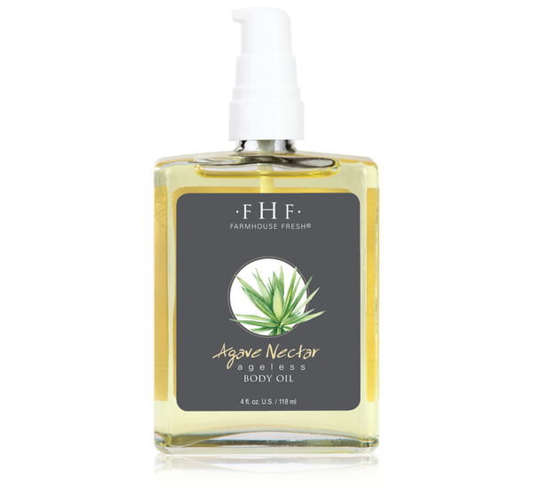 Clear square bottle of Agave Nectar Ageless Body Oil | Farmhouse Fresh with a pump dispenser and a dark label featuring an agave plant illustration for skincare and body care.