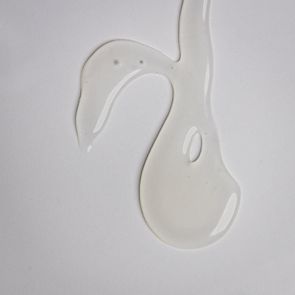 Clear gel texture sample of Purifying Gel Cleanser | Alchimie Forever on a white background, highlighting its smooth, lightweight skincare formula.