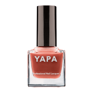Paris Nail Lacquer | YAPA in a sleek glass bottle with a rich coral shade and black cap, designed for professional-quality nail care and vibrant color.