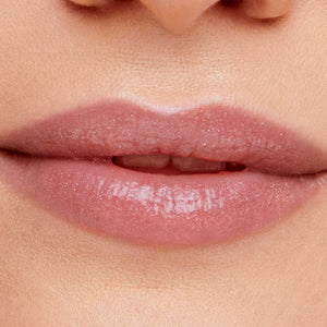 Close-up of lips with a subtle pink shimmer gloss applied, showcasing the smooth, hydrated look of Hydropure Hyaluronic Lip Gloss | Jane Iredale.