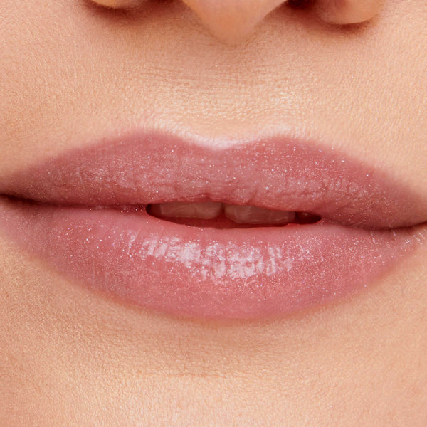 Close-up of lips with a subtle pink shimmer gloss applied, showcasing the smooth, hydrated look of Hydropure Hyaluronic Lip Gloss | Jane Iredale.