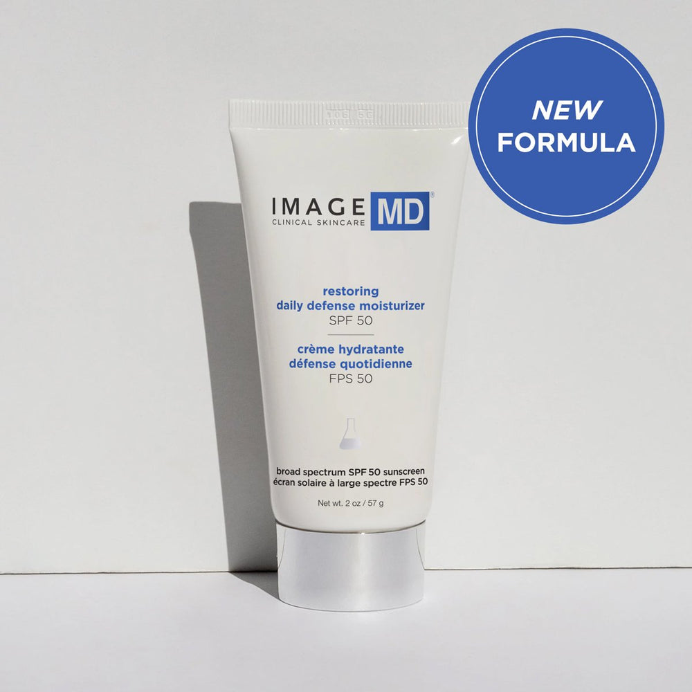 Tube of Restoring Daily Defense Moisturizer SPF 50 | IMAGE Skincare with white and blue packaging, designed for daily skincare and broad spectrum sun protection.
