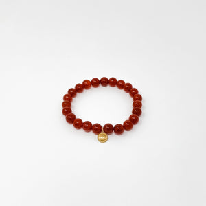 Assorted Satya Bracelets | Satya featuring a single-strand polished red bead design with a small gold charm, perfect for wellness and mindful style.