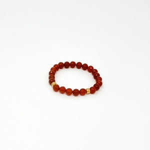 Assorted Satya Bracelets | Satya featuring polished red beads with gold accents, designed for style and wellness.