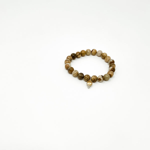 Assorted Satya Bracelets | Satya featuring natural stone beads in warm earth tones with a small decorative charm, designed for wellness and mindful style.