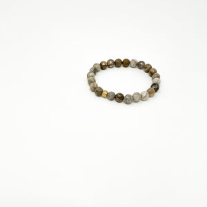 Close-up of an earth-toned beaded bracelet with mixed natural stone beads and a gold accent bead, part of Assorted Satya Bracelets | Satya collection.