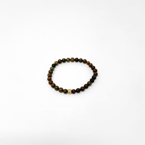 Assorted Satya Bracelets | Satya featuring a delicate circle of polished multicolored beads with natural earthy tones on a clean white background.