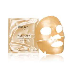 Gold-colored facial mask sheet with eye, nose, and mouth cutouts next to a matching gold sachet packaging for the Nanogold Repair Discovery Kit | Knesko, promoting skincare and hydration.