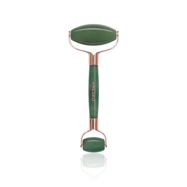 Green jade facial roller with rose gold accents, part of the Nanogold Repair Discovery Kit | Knesko, designed for skincare and wellness massage routines.