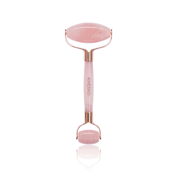 Rose quartz facial roller with smooth stone edges, designed for skincare and wellness, part of the Rose Quartz Antioxidant Discovery Kit | Knesko.