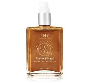 Lustre Drench® Instant Glow Dry Oil | Farmhouse Fresh in a clear rectangular bottle with shimmering golden dry oil and a white pump top, designed for skincare and body care.