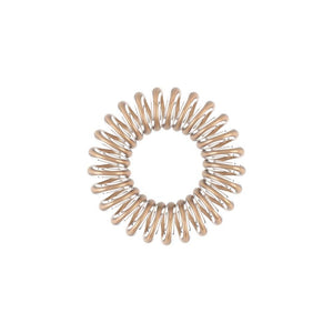 Close-up of a single beige spiral hair tie from the ORIGINAL Value Pack 8 pc | invisibobble designed for gentle, no-damage hair styling.