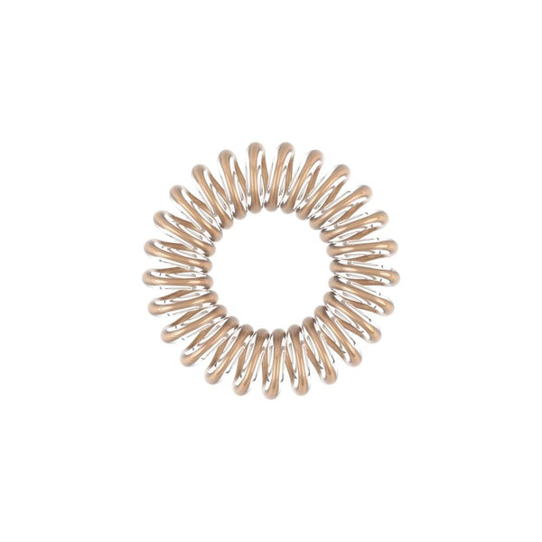 Close-up of a single beige spiral hair tie from the ORIGINAL Value Pack 8 pc | invisibobble designed for gentle, no-damage hair styling.