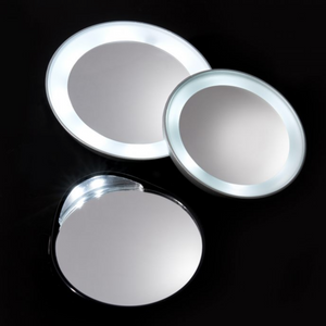 Three round illuminated mirrors with bright LED lighting, showcasing the LED 15X Lighted Mirror | Tweezerman perfect for detailed skincare and beauty routines.