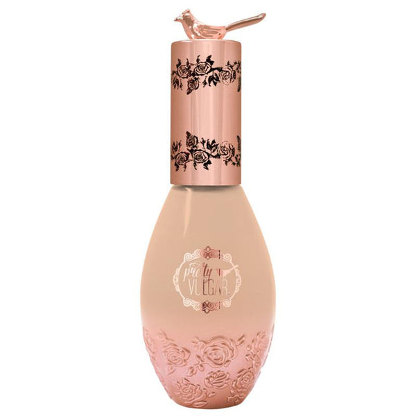 Elegant beige foundation bottle with rose gold floral embossing and a rose gold cap topped with a small bird, labeled Cool AF Lava Water Foundation | Pretty Vulgar.