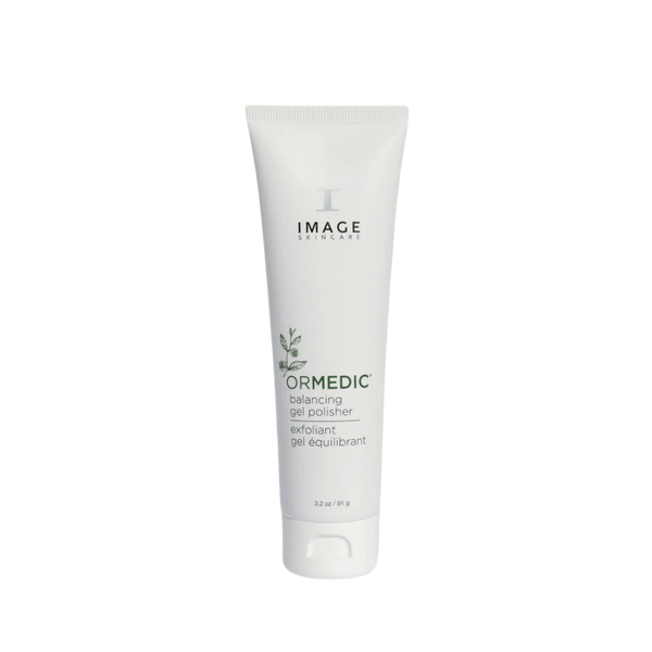 Tube of ORMEDIC balancing gel polisher | IMAGE Skincare exfoliant with a white minimalist design, featuring green leaf graphics for skincare and wellness.