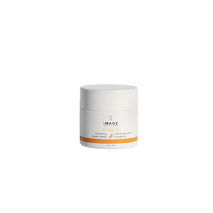 White jar of VITAL C hydrating repair crème | IMAGE Skincare with minimalistic design and orange accent for skincare and hydration.