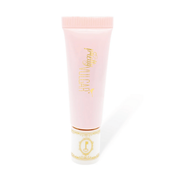 Tube of Uncaged Eyeshadow Primer | Pretty Vulgar in soft pink packaging with gold lettering, designed for smooth and long-lasting eyeshadow application.