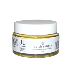 Jar of Lavish Simply Calendula Antioxidant Crème | JL Essencials featuring a white lid and clear container showing yellow tinted cream inside for skincare and wellness.