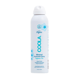 Spray bottle of Mineral Body Organic Sunscreen Spray SPF 30 | COOLA featuring 70% organic ingredients, broad spectrum protection, and a sheer, hydrating formula with a floral design.