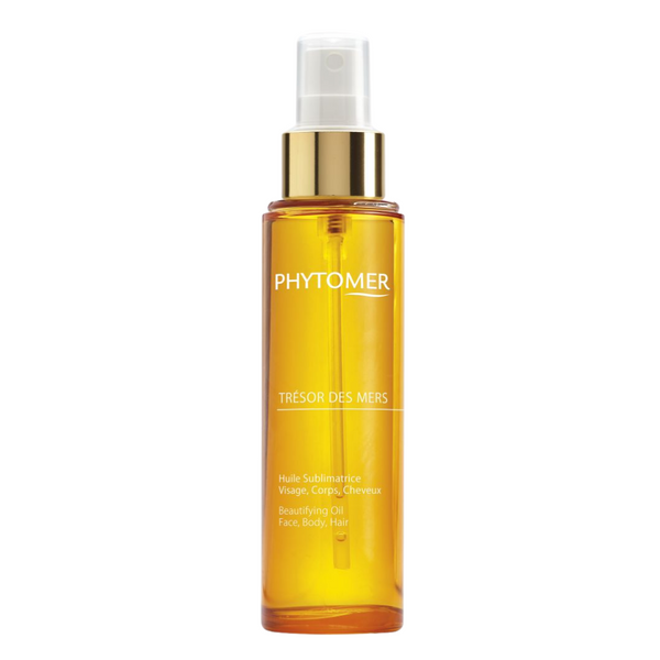Trésor Des Mers (Beautifying Oil Face, Body, Hair) | Phytomer in a sleek transparent spray bottle with golden liquid, designed for skincare and body care wellness.