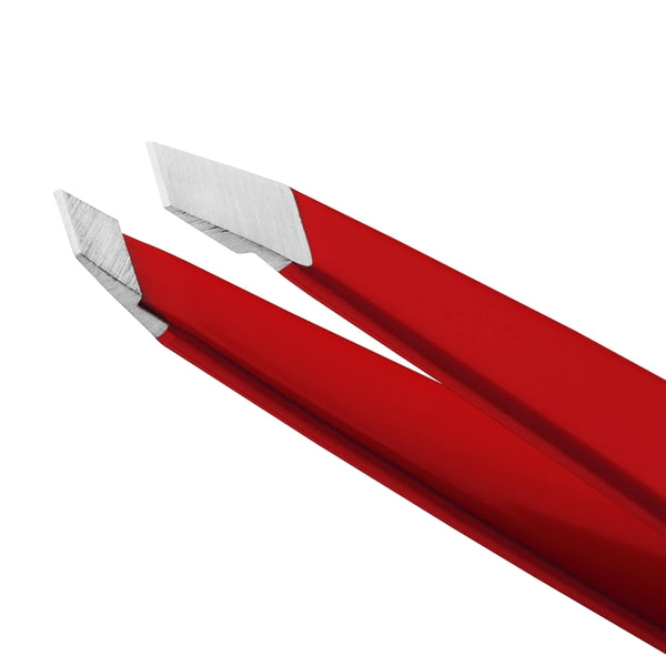 Close-up of precision stainless steel tips on red Slant Tweezer | Tweezerman used for detailed eyebrow grooming and skincare care routines.