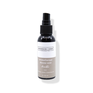 Bottle of Aromatherapy Shower Mist | Essence One with a spray nozzle, featuring a minimalist white and beige label promoting natural and therapeutic body care for wellness and relaxation.